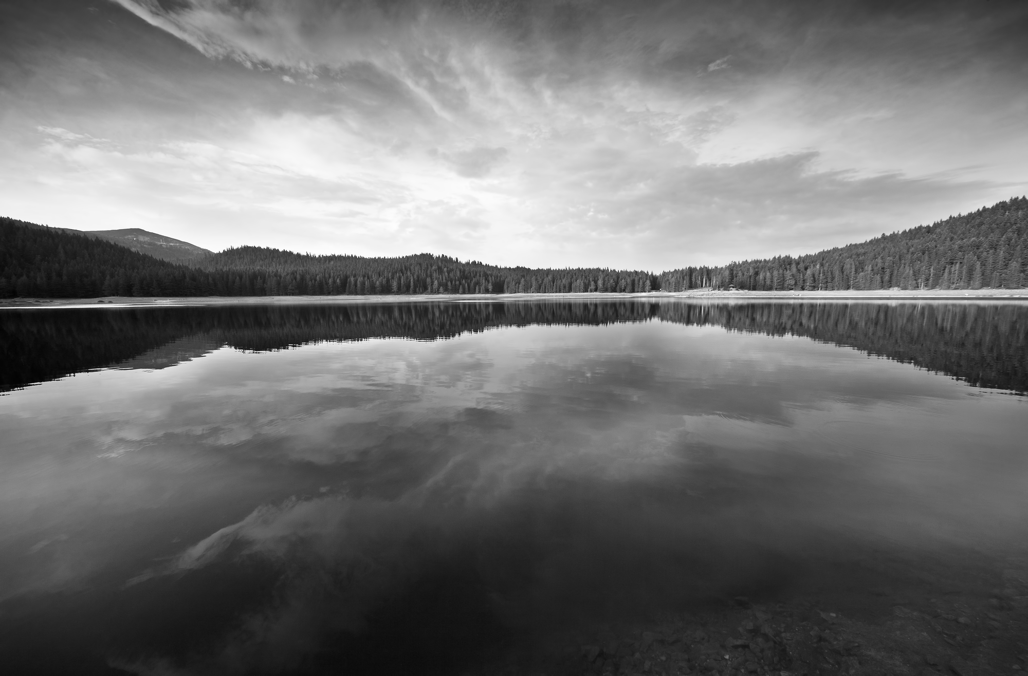Still lake reflecting the mountains